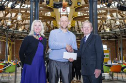 Derby College Chief Executive Mandie Stravino, Plastering learner Haralds Johans and Bowmer & Kirkland Chairman John Kirkland