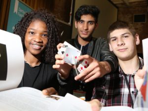 Derby College Lexis Students pose at book launch